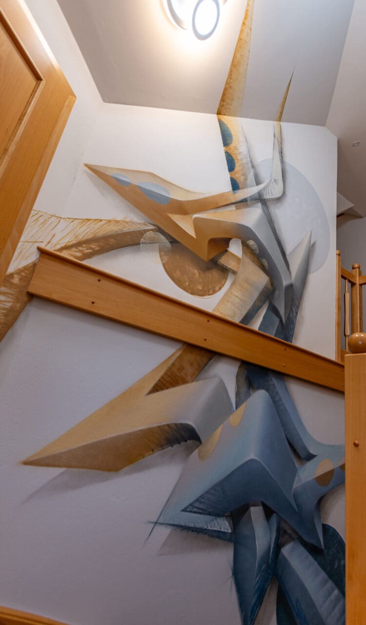 staircase with 3D graffiti in grey and brown
