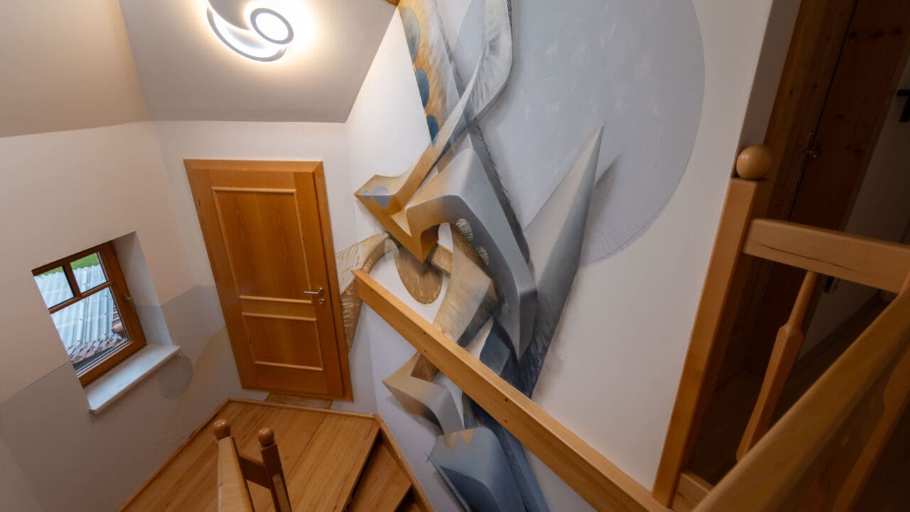 staircase with 3D graffiti in grey and brown