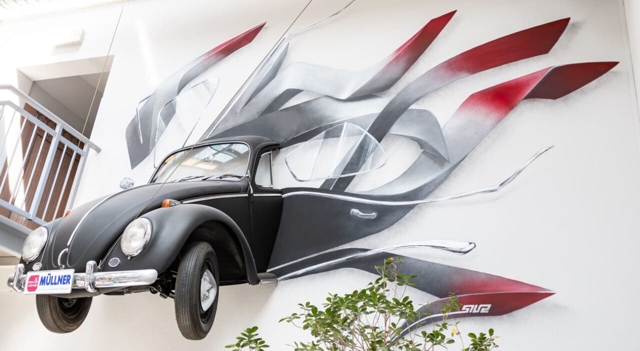 Ein VW Käfer als Graffiti Gesamtaufnahme